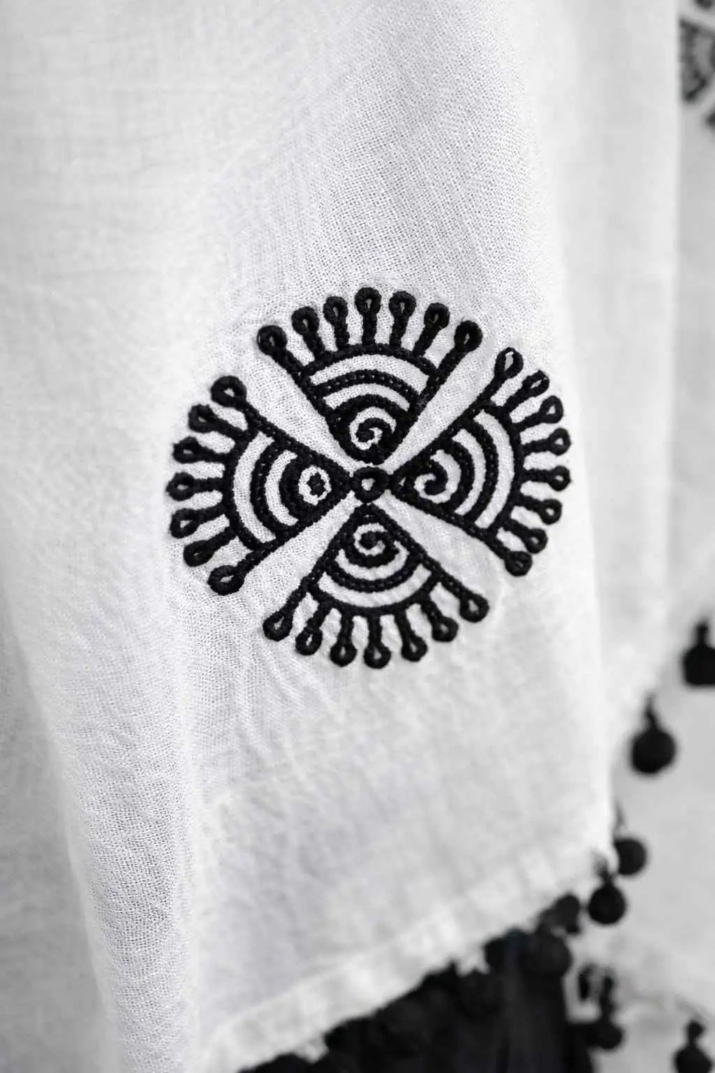 Marjeena white embroidered dupatta with colorful pom-pom borders, traditional ethnic accessory for festive occasions.