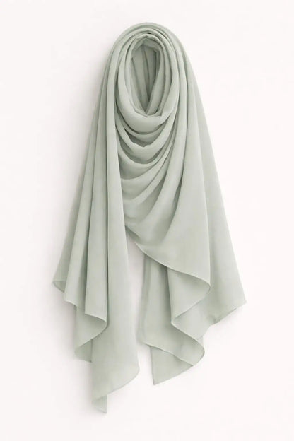 Light grey Marjeena premium jersey hijab displayed flat, showcasing soft fabric and simple elegant drape for modest styling.