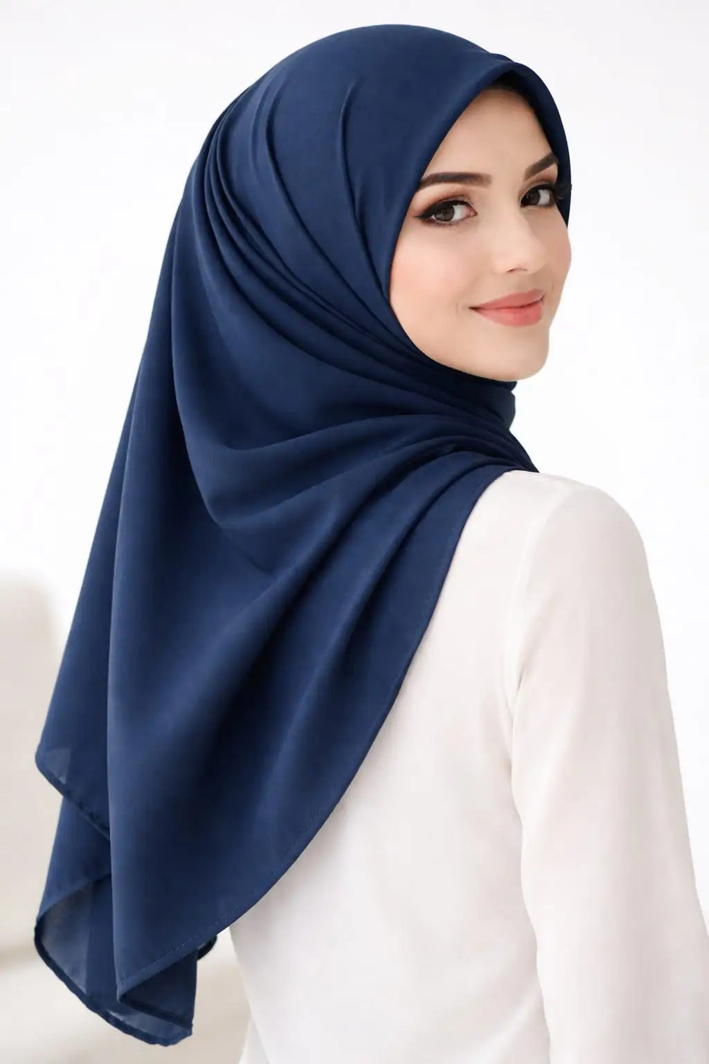 Marjeena navy blue premium jersey hijab draped stylishly, showcasing soft, breathable fabric and elegant design for modest fashion.