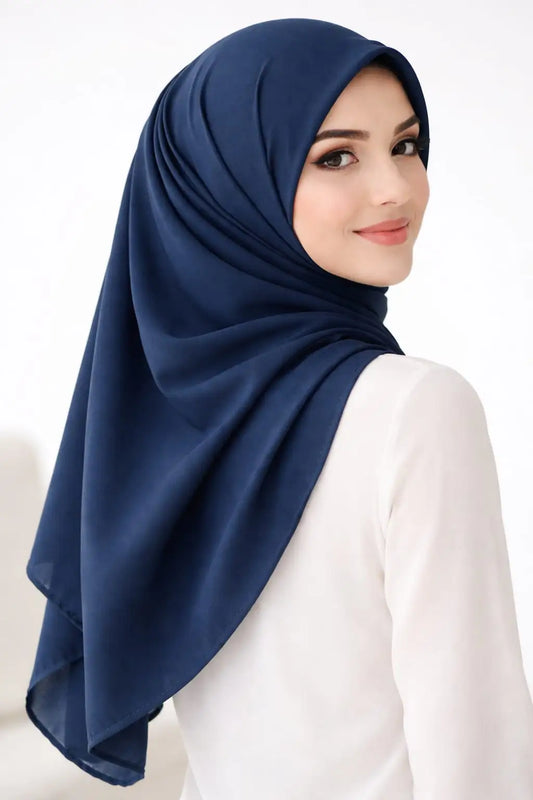 Marjeena navy blue premium jersey hijab draped stylishly, showcasing soft, breathable fabric and elegant design for modest fashion.