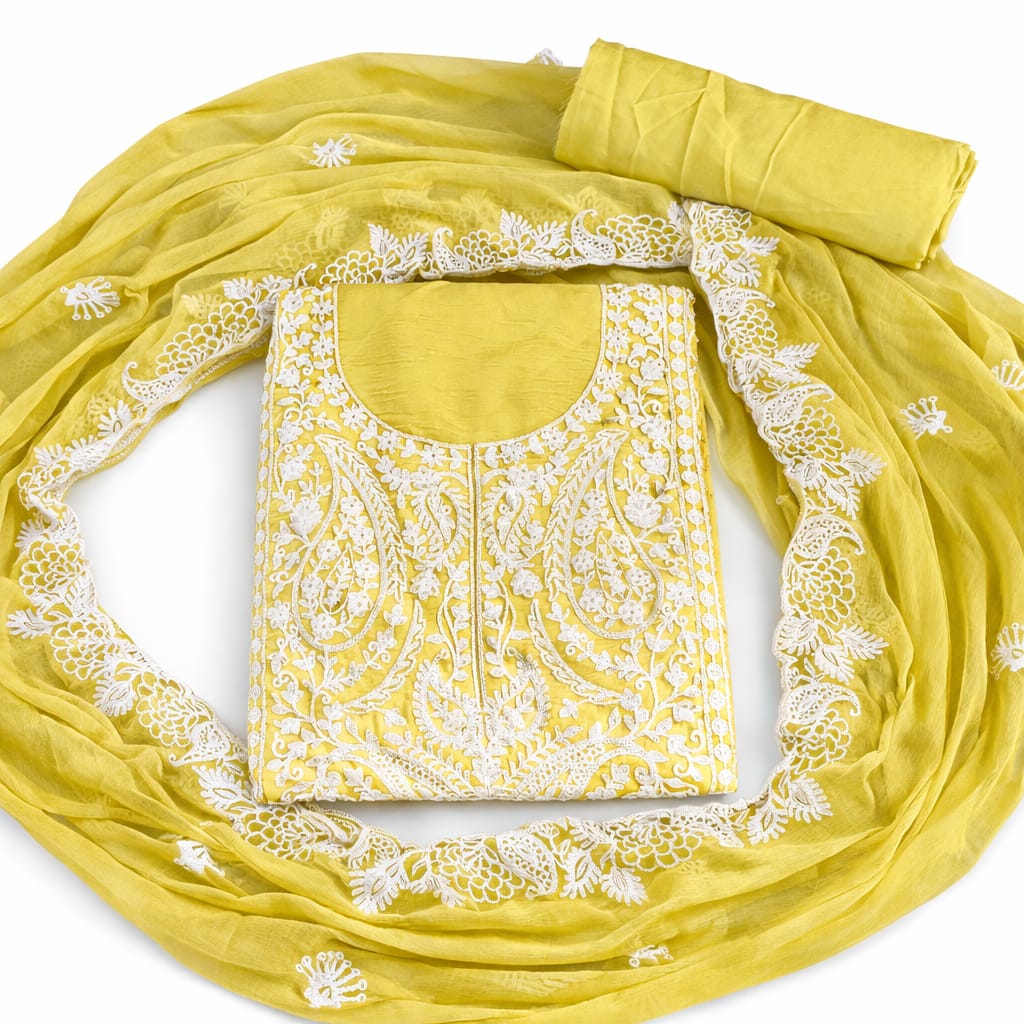 Marjeena Mustard Yellow Lucknowi Chikankari unstitched suit set with paisley embroidery and intricate embroidery details.