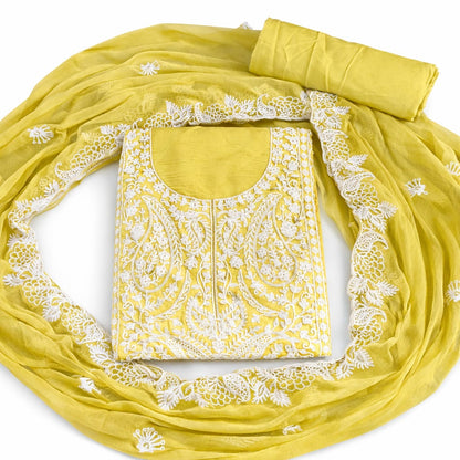 Marjeena Mustard Yellow Lucknowi Chikankari unstitched suit set with paisley embroidery and intricate embroidery details.